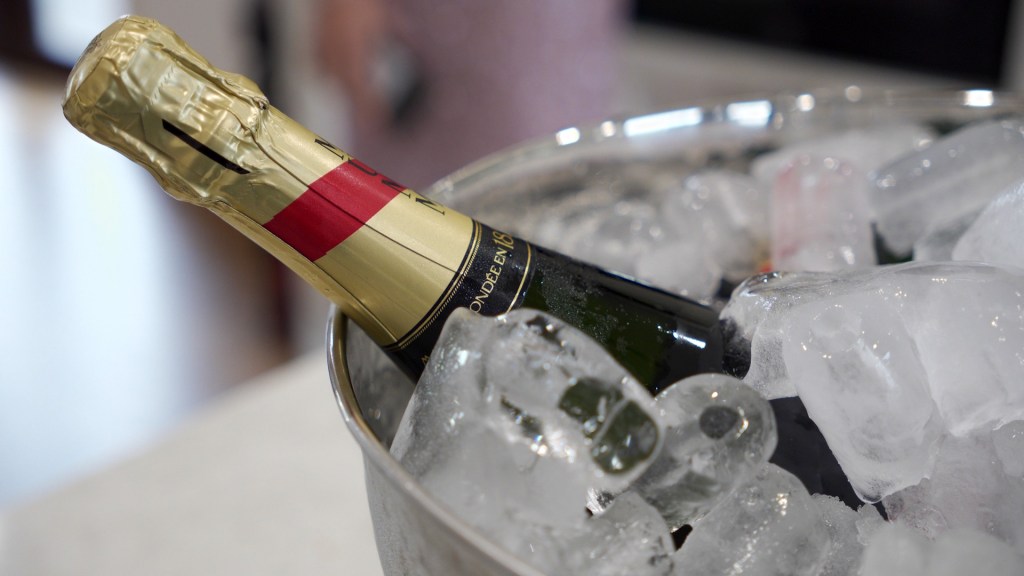 Mumm Champagne bottle chilling in an ice bucket at the girls' house.
