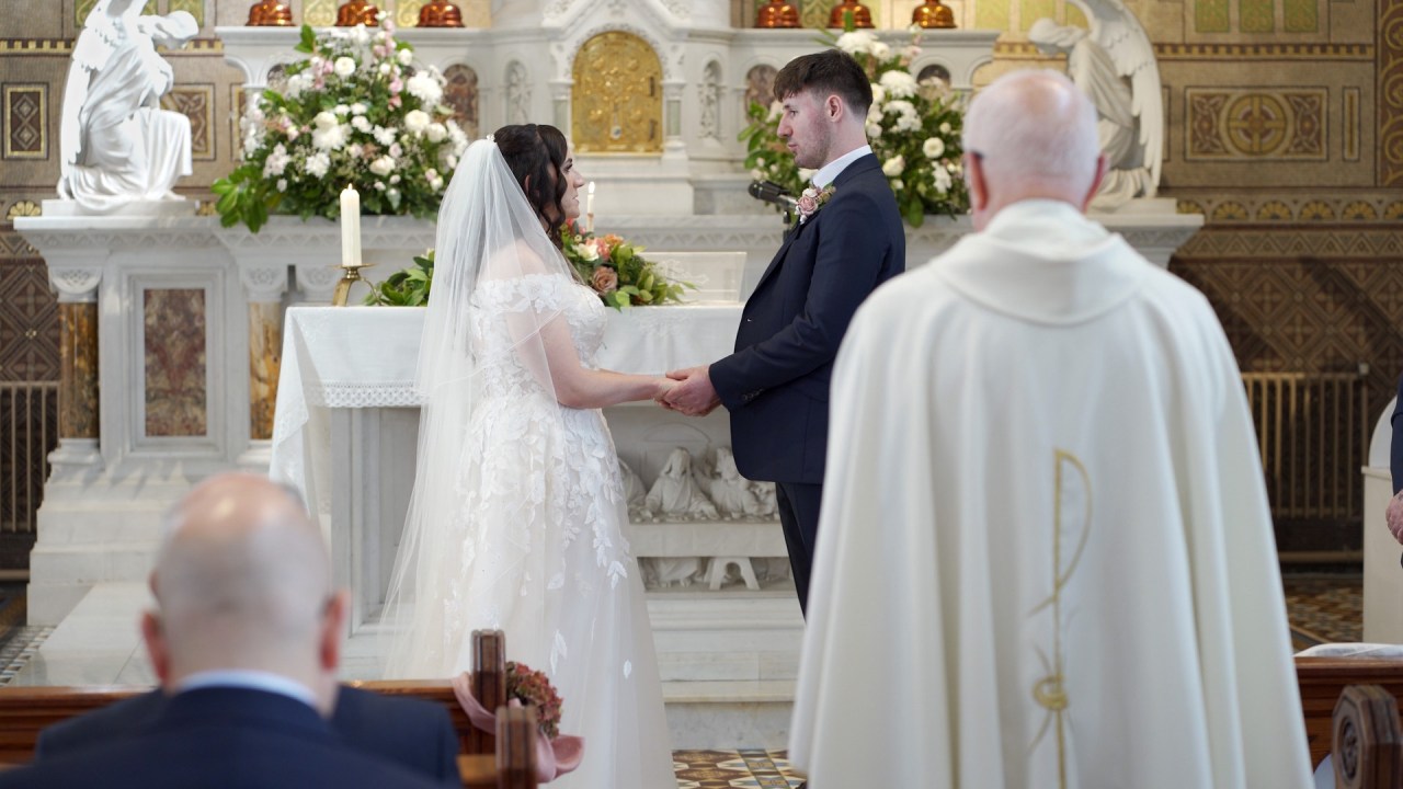 Tara and Malachy exchanging wedding vows at Church of the Sacred Heart Newry.