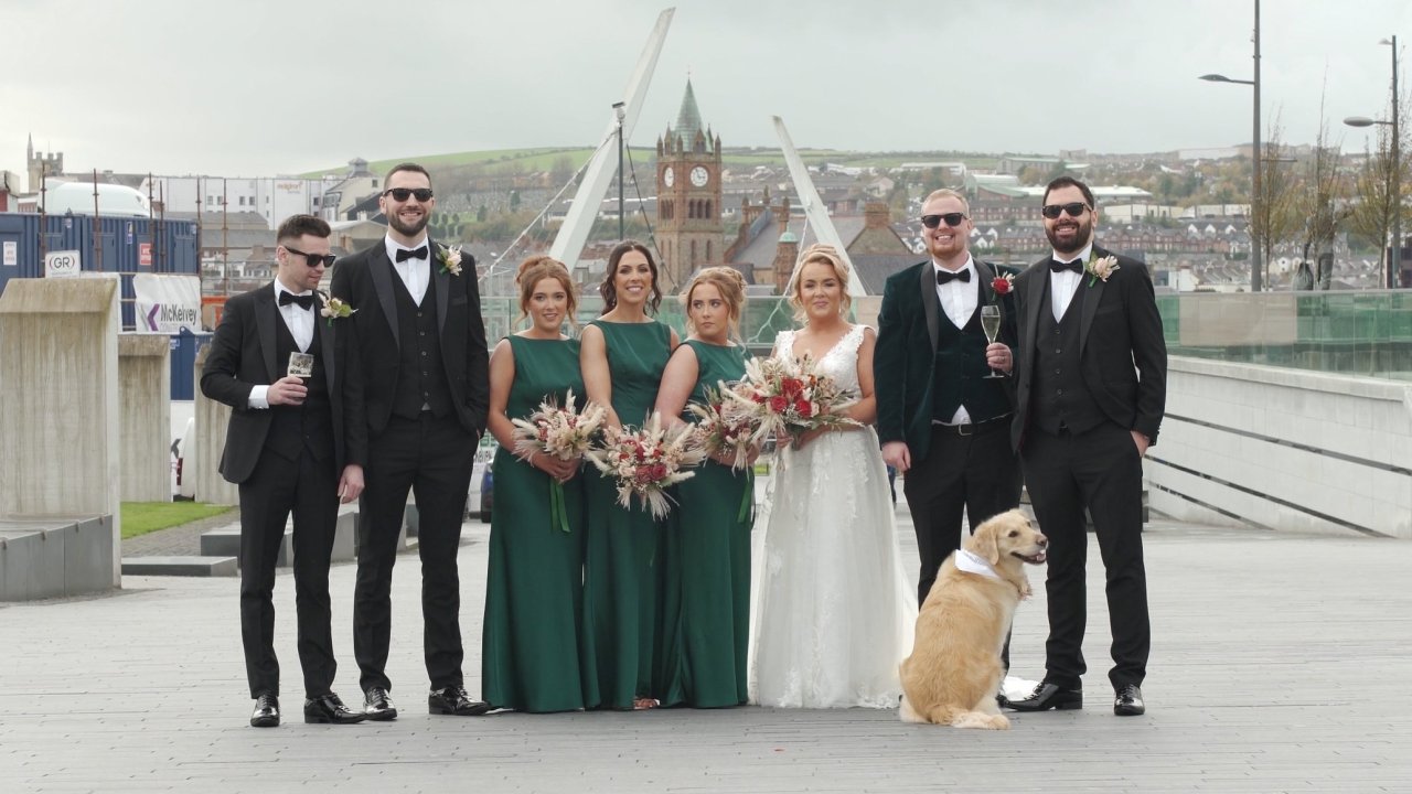 Full bridal party and their dog on the Ebrington Square walkway.
