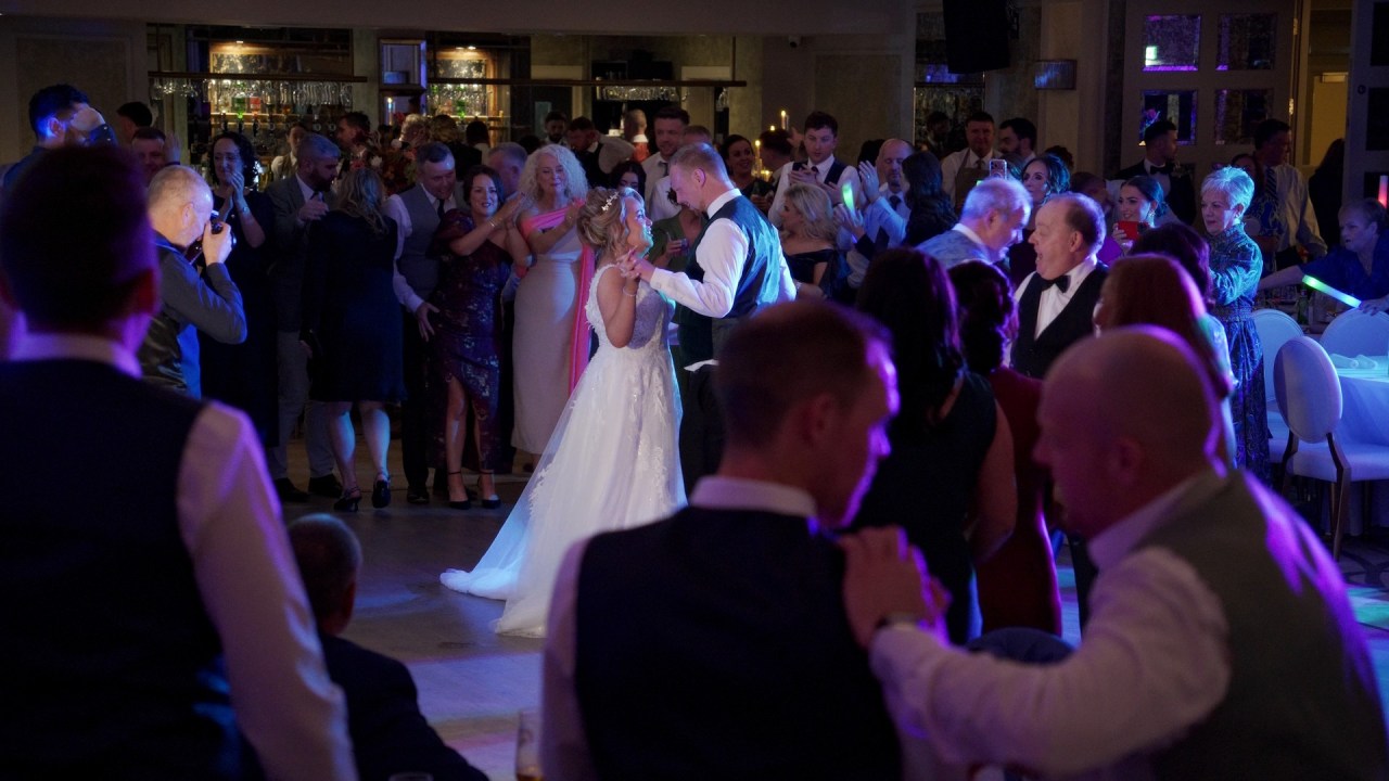 First dance at The Ebrington Hotel ballroom with wedding guests looking on.