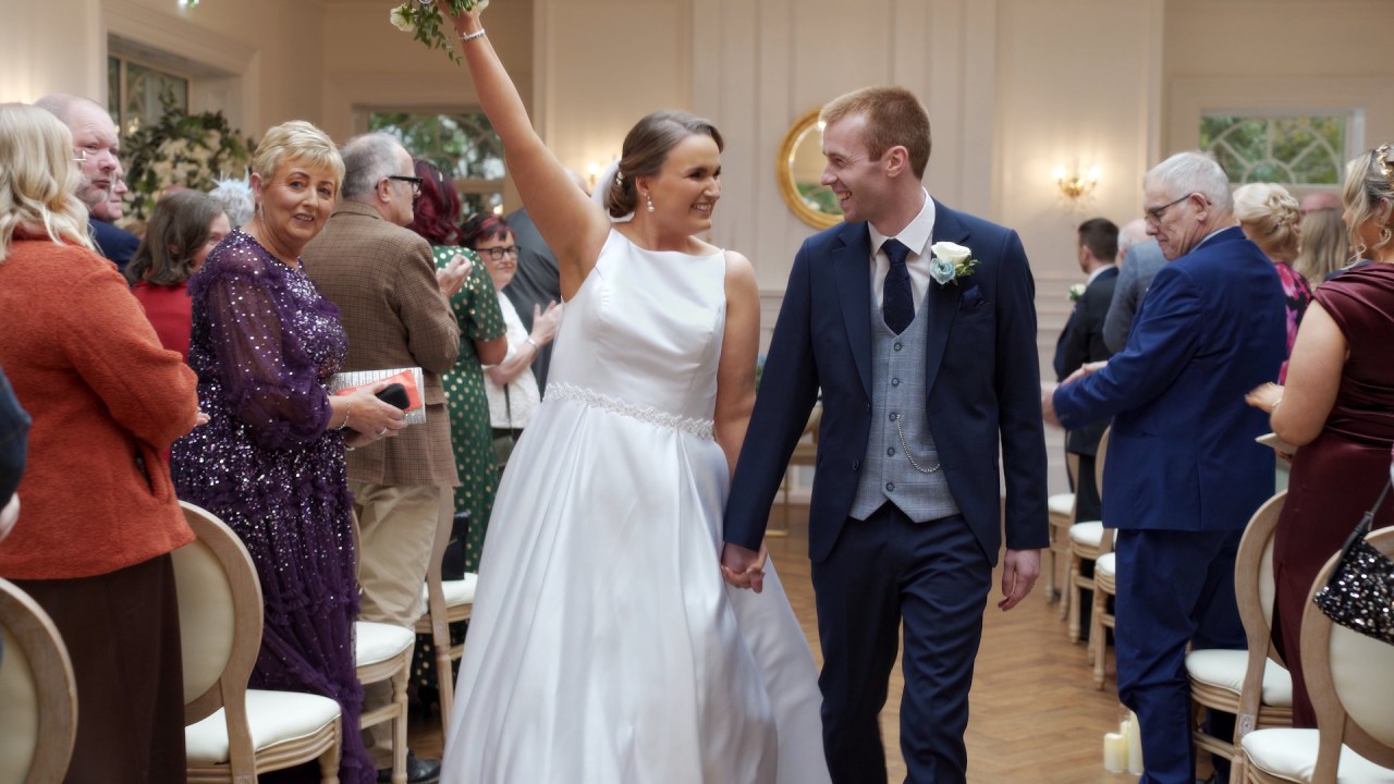 Tracey and Andrew walking up the aisle after their Leighinmohr House wedding ceremony.