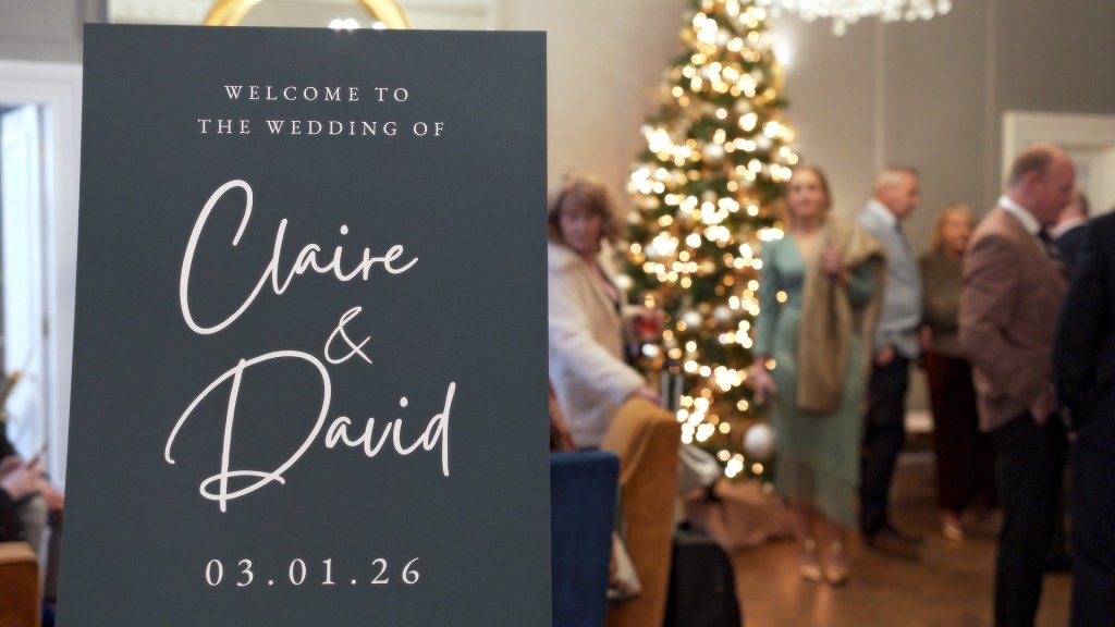 Welcome sign for Claire and David's wedding at Leighinmohr House Hotel with a Christmas tree.