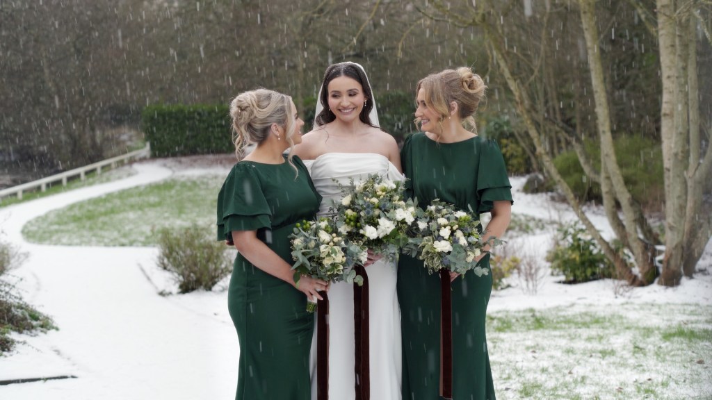 Claire with her bridesmaids in forest green dresses during a winter wedding at Leighinmohr House.