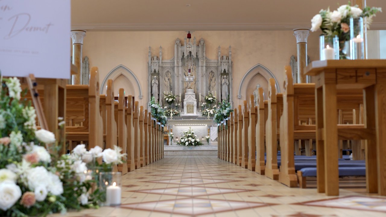 Interior of St Patrick's Church, Aghyaran, decorated with white flowers for Roisin and Dermot’s wedding.