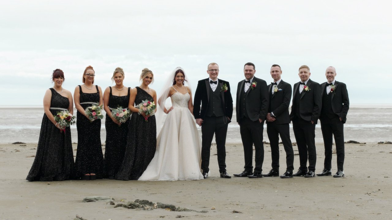 Full bridal party lineup at Priest's Beach Blackrock for Kelly and Conall’s wedding.