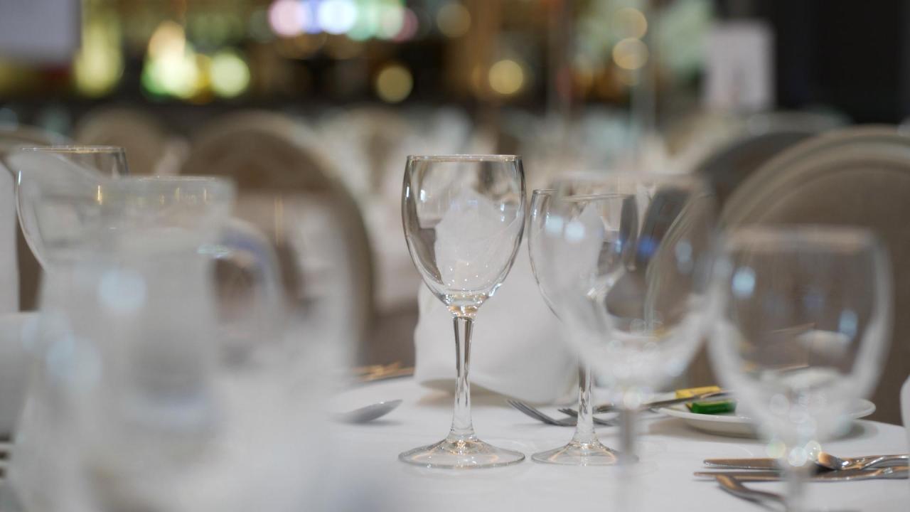 Elegant wedding table setting with wine glasses at the Hillgrove Hotel reception in Monaghan.